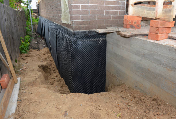 Happy homeowners after waterproofing job in Ragland